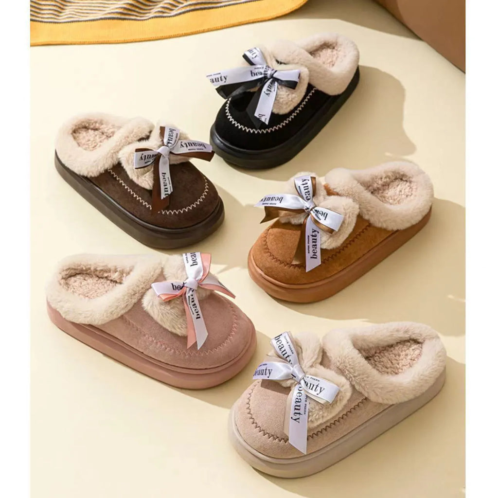 Women's beige suede half slippers with a ribbon bow and thick sole.