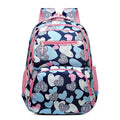 Blue student backpack with air cushion straps on a grey background, showing large main compartment.