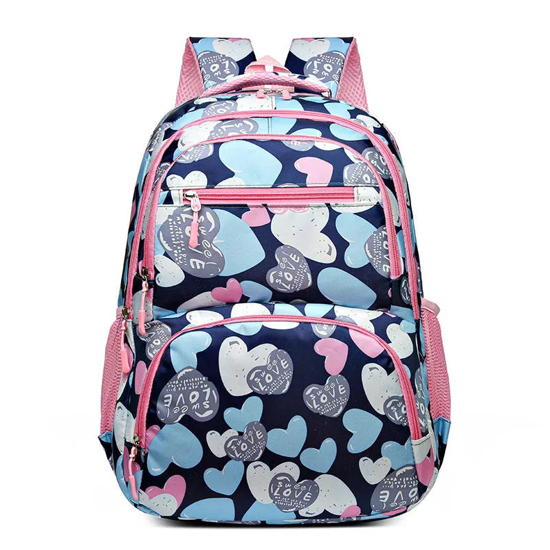 Blue student backpack with air cushion straps on a grey background, showing large main compartment.