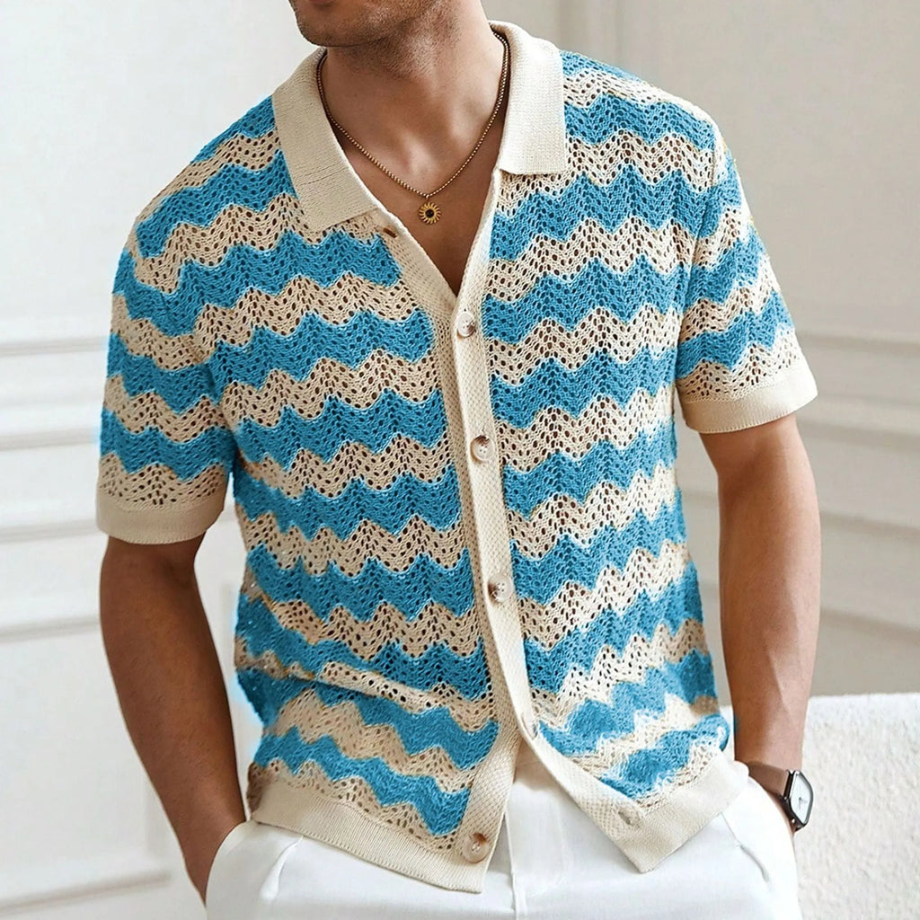 Man's short-sleeve blue sweater with a textured corduroy-like jacquard pattern, showing detail of the fabric weave.