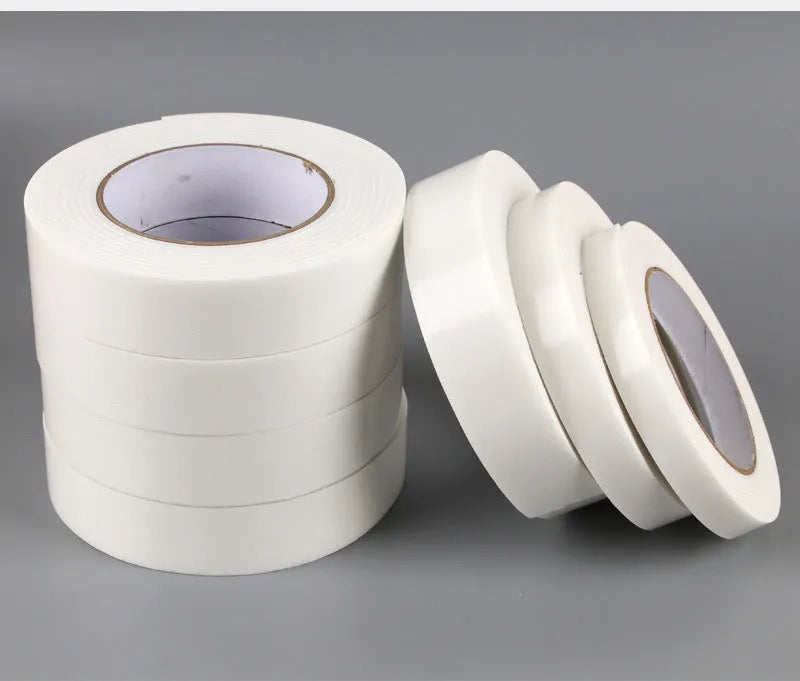 Roll of 3mm thick white foam double-sided adhesive tape with clear BOPP liner, showing width options.