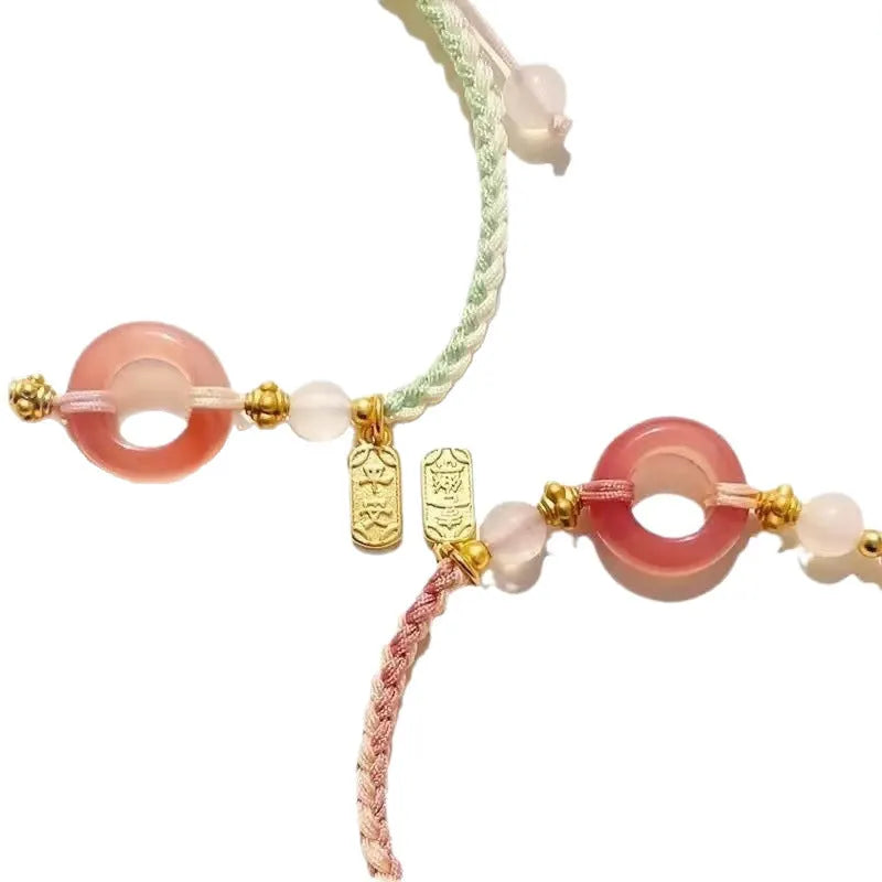 DIY woven watch band with peach blossom patterns in green, pink, and black colour options