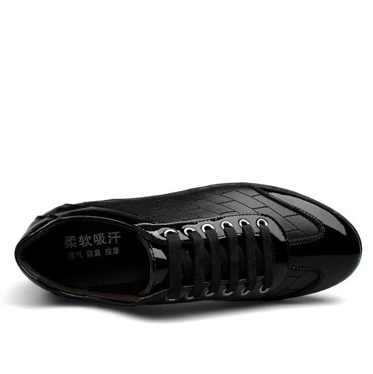 Genuine leather casual men's shoes in black with lace-up closure on a plain background