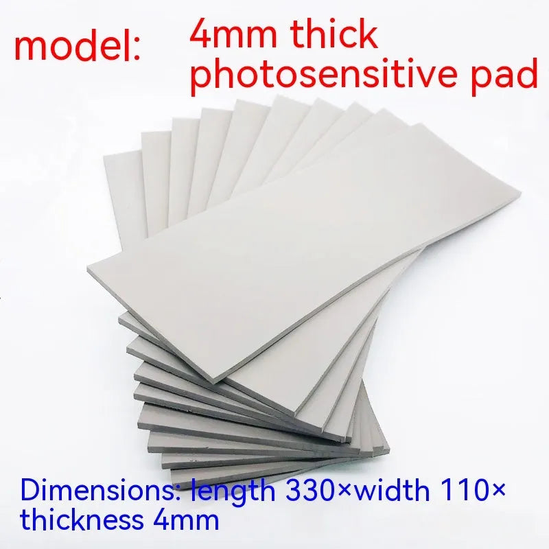 Black and grey plastic light-sensitive mat for seal making, showing 2mm, 4mm, and 7mm thickness options.