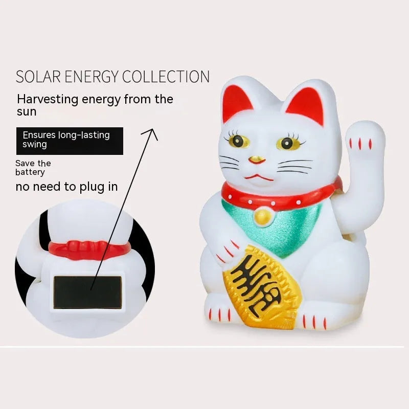 Small yellow solar powered Maneki Neko lucky cat decoration waving its arm.