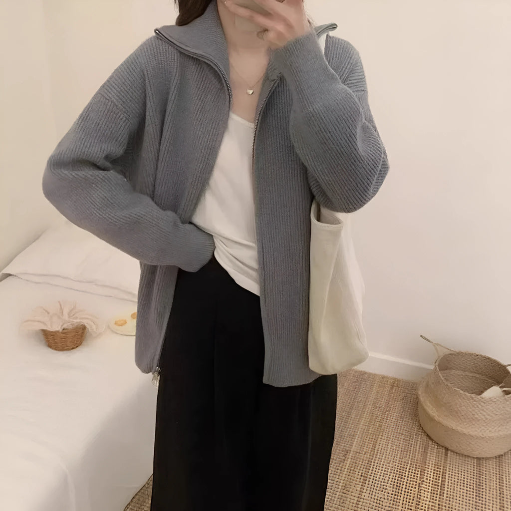 Hong Kong style grey double zipper knitted cardigan jacket on a hanger