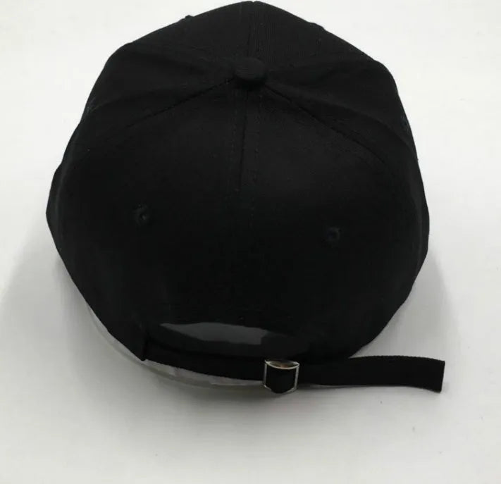 Black cotton baseball cap with white letter embroidery, curved brim, adult size