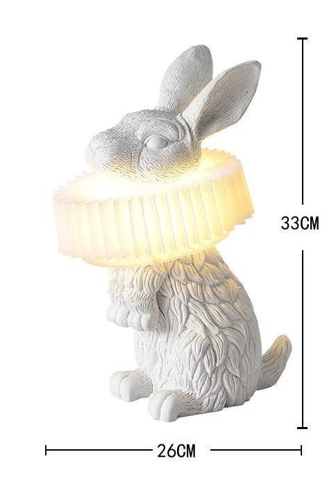 Modern customisable bedside lamp with choice of white or black rabbit silhouette designs.