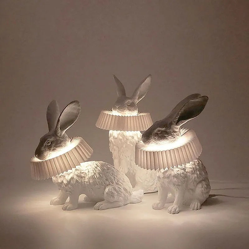 Modern customisable bedside lamp with choice of white or black rabbit silhouette designs.