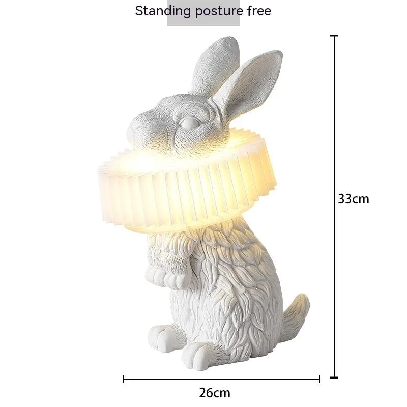 Modern customisable bedside lamp with choice of white or black rabbit silhouette designs.