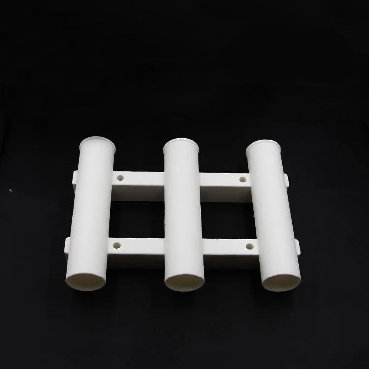 Black or white 3-hole sea fishing rod turret in ABS plastic, 31.5cm x 22.6cm x 6.5cm, with 5cm rod holes.