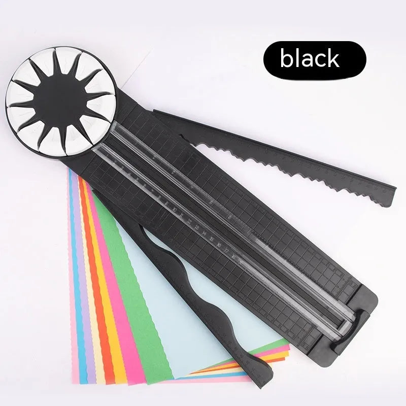 A pink plastic 12-in-1 multifunctional paper cutter with a dotted design on a flat surface.