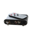 Silver aluminium audio source selector switch unit with front panel button and infrared remote.