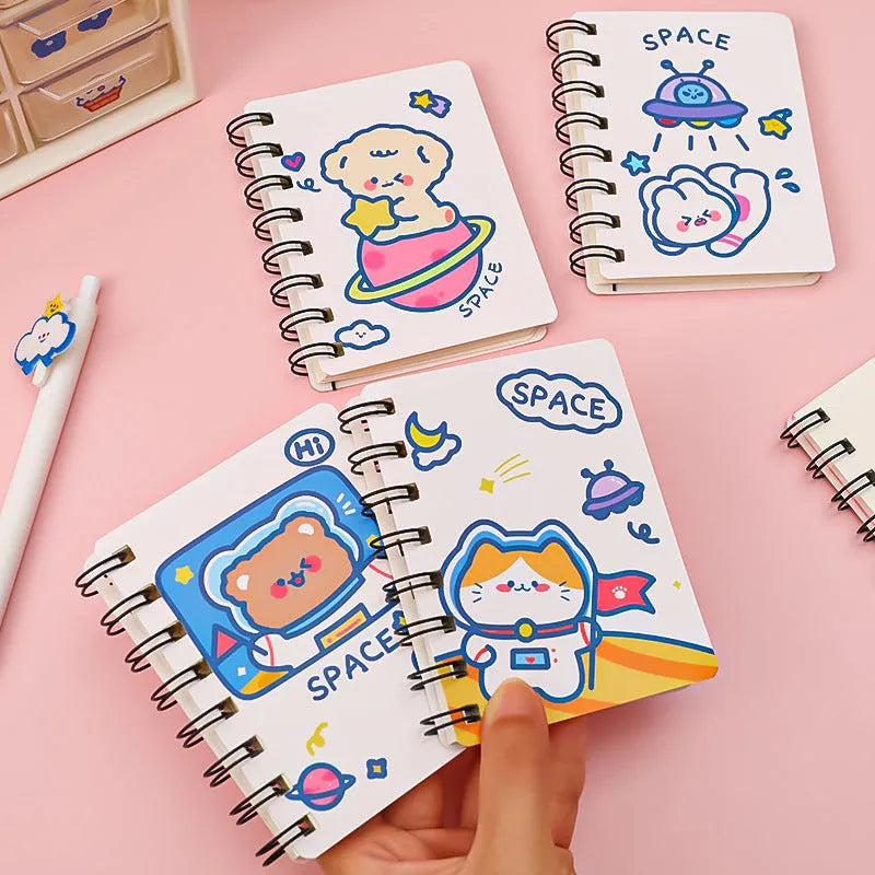 Astronaut Series portable pocket flipper notebook showing one of four cover designs: Astronaut Bear, Planet Teddy, Space Cat, or UFO.