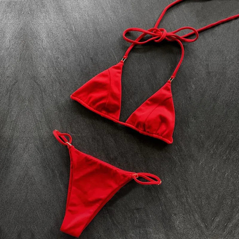 Women's nylon split bikini in red, backless triangle cut, on model at beach