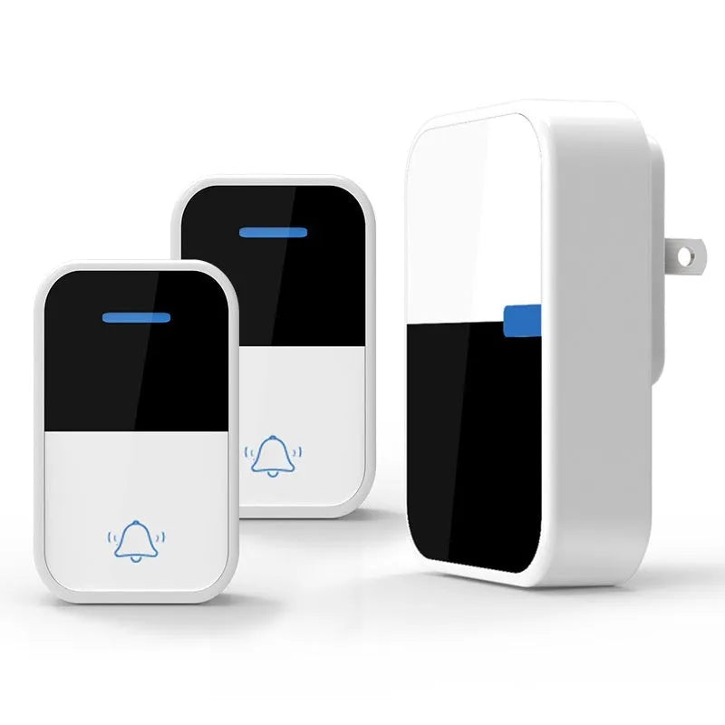 White plastic wireless doorbell kit with plug-in chime and self-powered button, shown with EU and US plugs.
