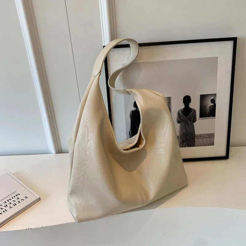 Casual soft PU leather shoulder bag in street trend style with a sandwich pocket.