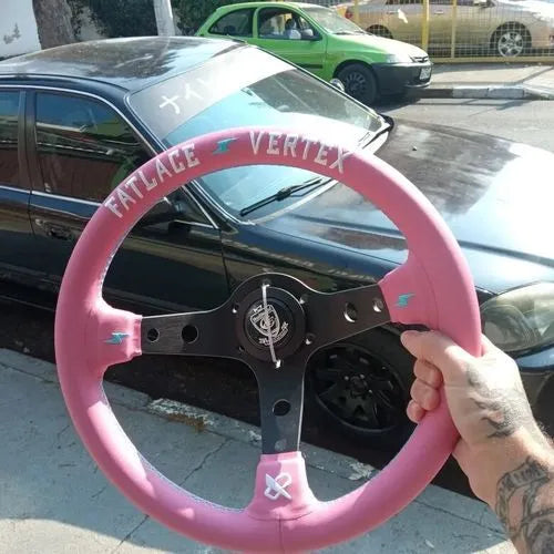 Pink leather steering wheel cover with embroidery, showing aluminium bracket