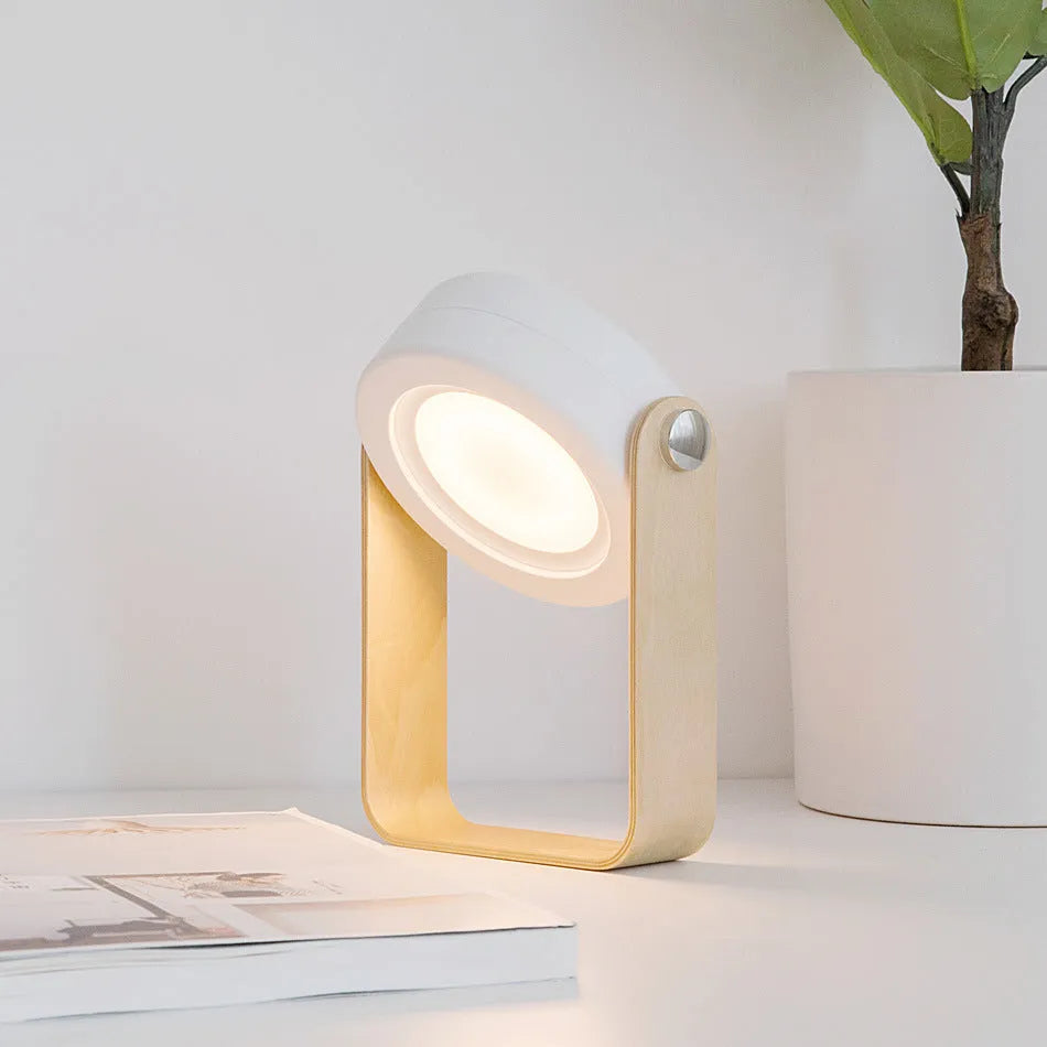 Foldable touch dimmable LED reading lamp in white showing table and lantern configurations