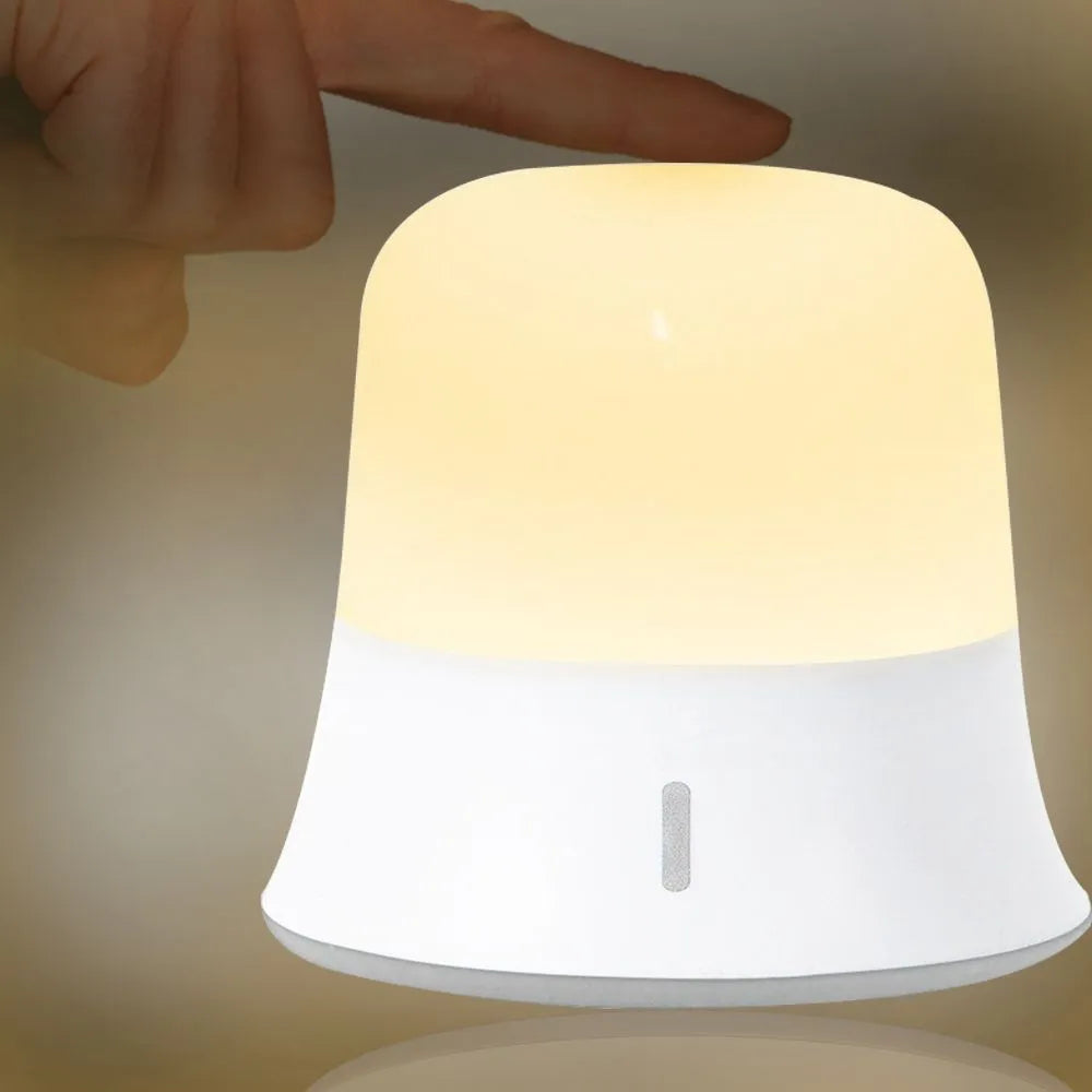 White bedside night light with touch controls, motion sensor, and rechargeable battery.