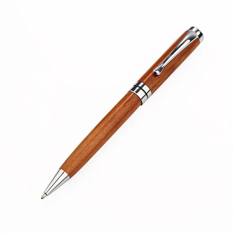 Gold metal and rosewood rollerball pen on a desk, 14cm long