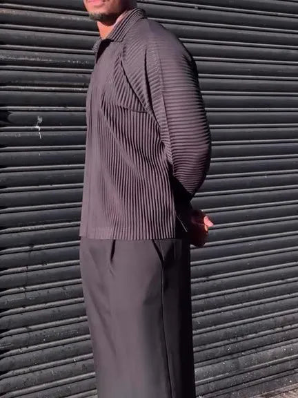 Black men's long-sleeved casual shirt with a pleated design detail on the front.