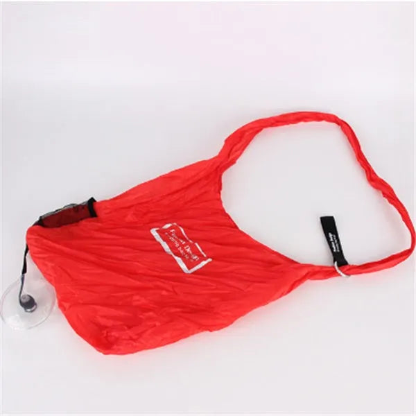 Disc folding portable shopping bag in red unfolded showing 33x40x10cm size with compact 10.5cm disc beside it