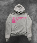 Black heavy hooded sweater with white letter print on chest, shown on a model.