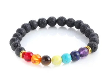 Handmade black lava seven chakra beaded bracelet on neutral background, 8mm or 10mm beads