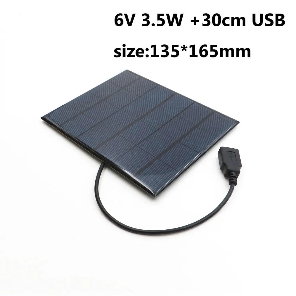 Portable solar panel unit with a small fan and a USB charging port for mobile phones.