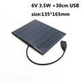 Portable solar panel unit with a small fan and a USB charging port for mobile phones.