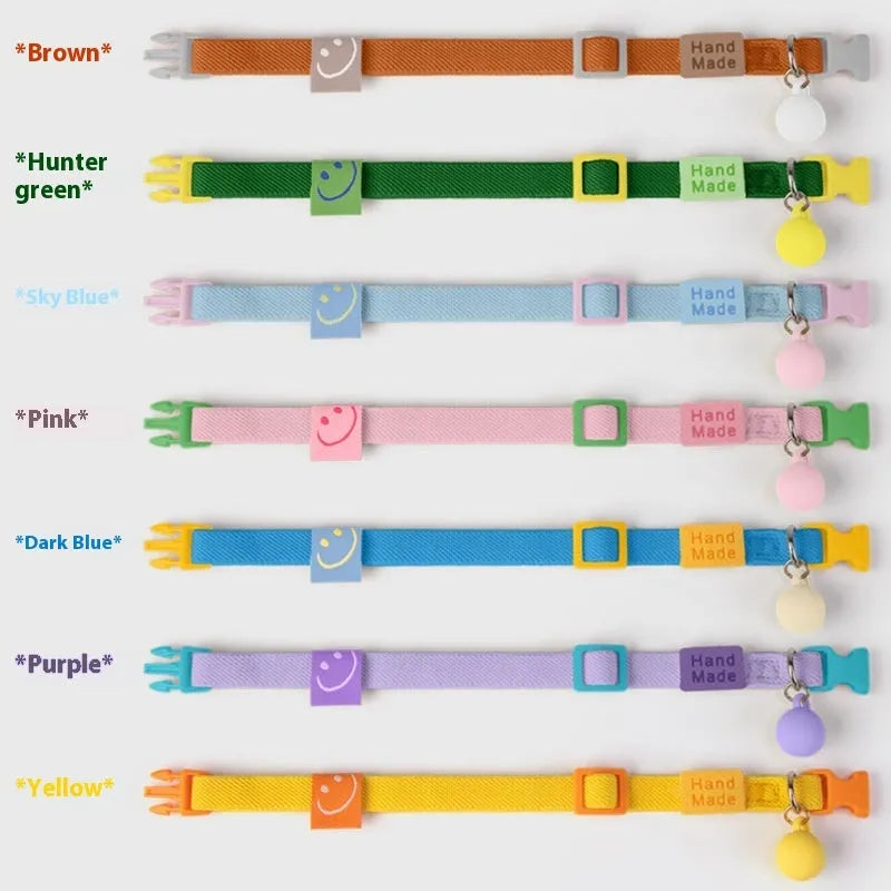 A stretchy, solid-colour polyester dog collar for small breeds, shown in sky blue, adjustable from 22 to 32 centimetres.
