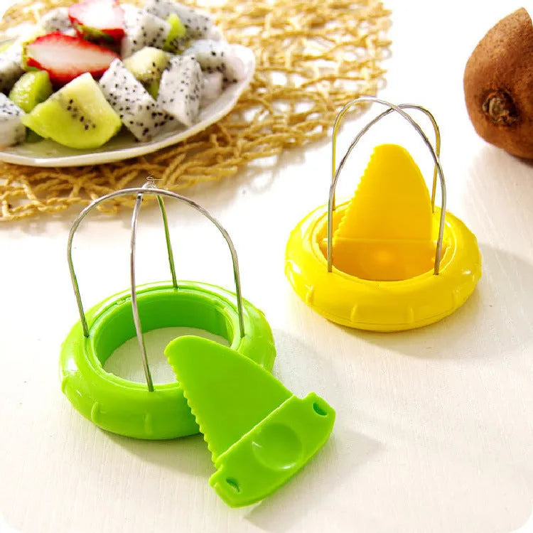 Mini kiwi cutter peeler slicer with stainless steel blade and ABS body on a kitchen surface
