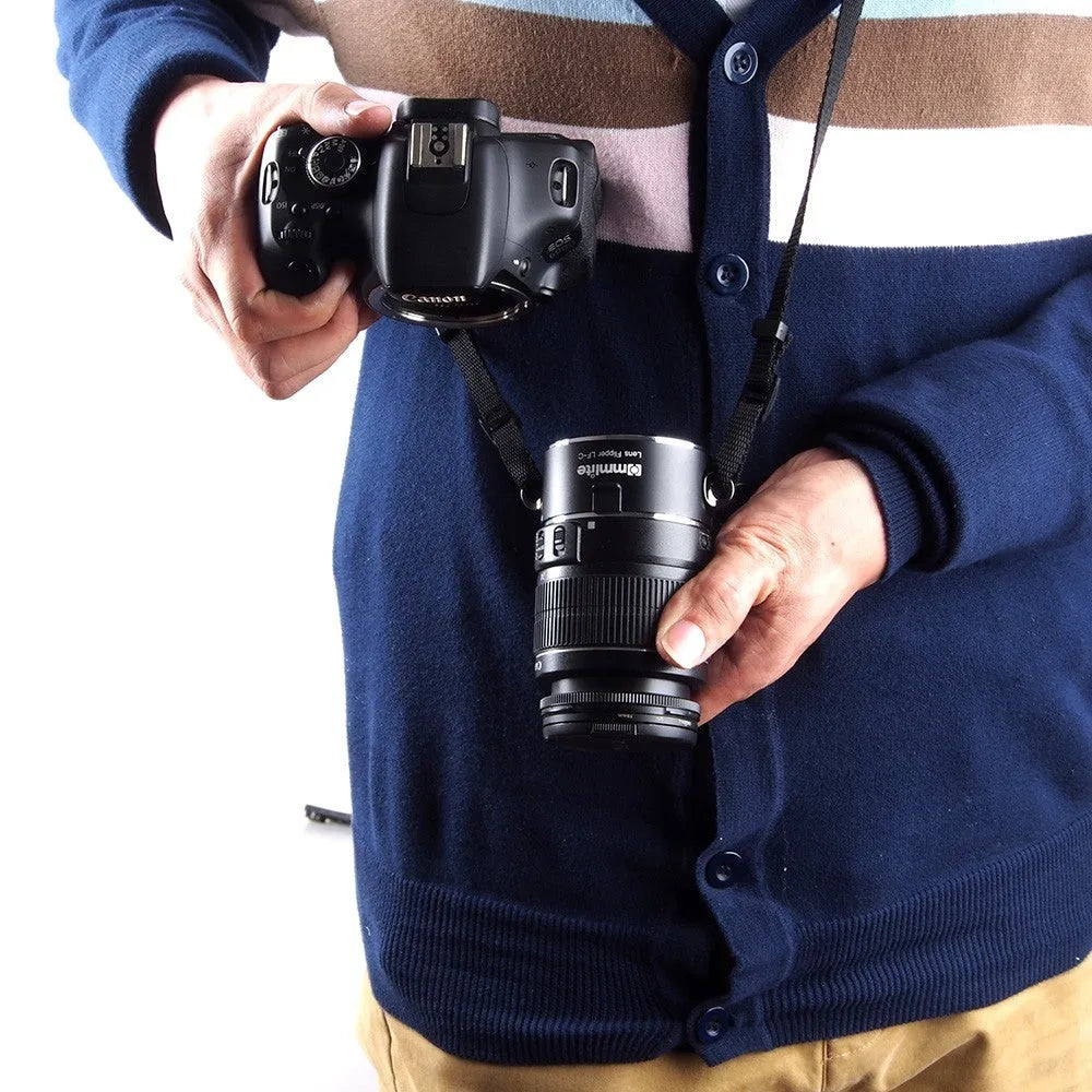Aluminium camera lens flipper holder on a cotton shoulder strap for quick lens changes