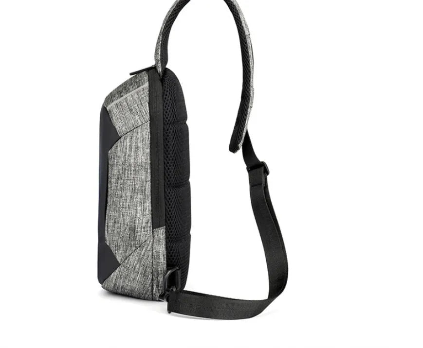 Dark blue Oxford cloth chest bag with adjustable strap, worn across the chest, showing front zipper and square shape.