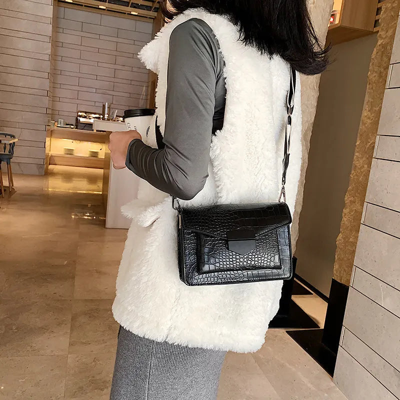 Vintage PU leather crossbody bag shown in black, dimensions 20cm by 14cm.