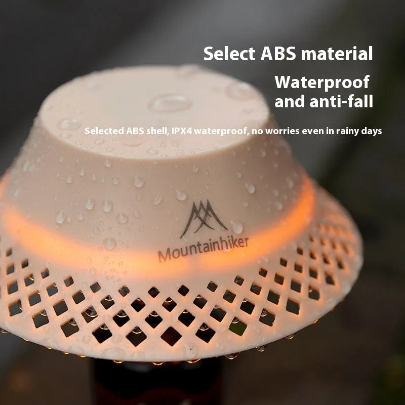 Beige and grey repurposed wine bottle camping lanterns with a gear switch on top for adjusting light mode.