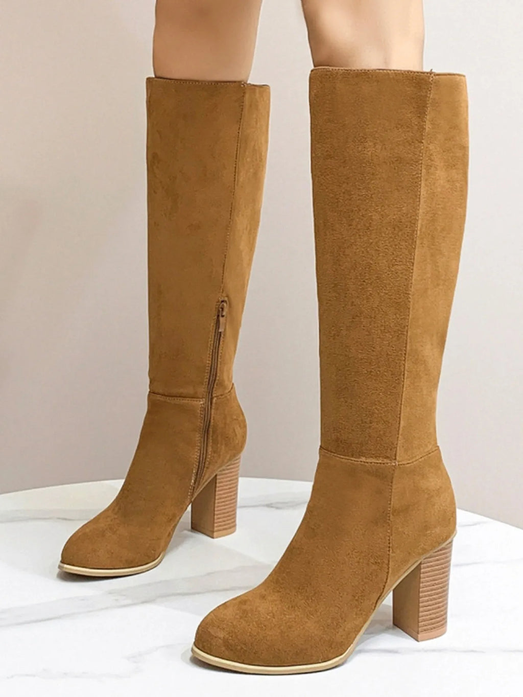 Women's square toe high heel boots in black and dark brown colours, showing artificial PU upper material