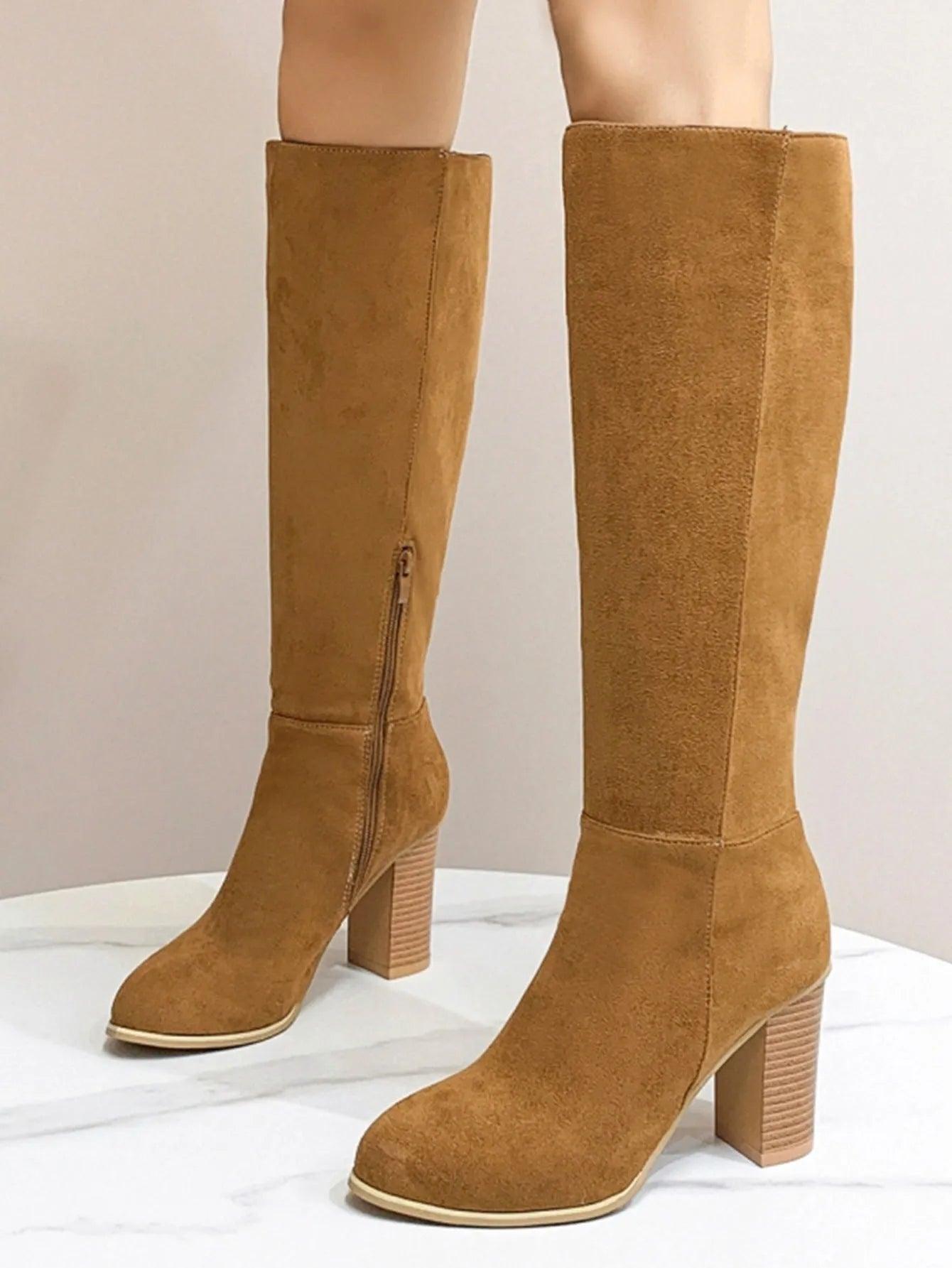 Women's square toe high heel boots in black and dark brown colours, showing artificial PU upper material