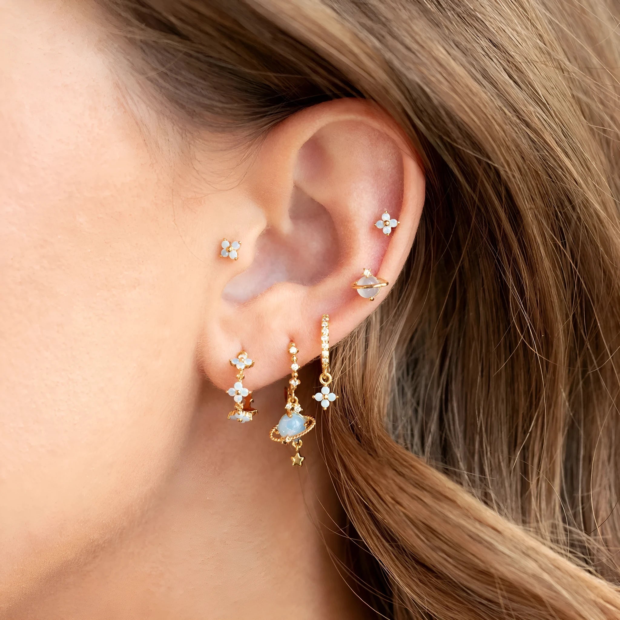 Gold and silver blue floral stud earrings with zircon mosaic on copper.