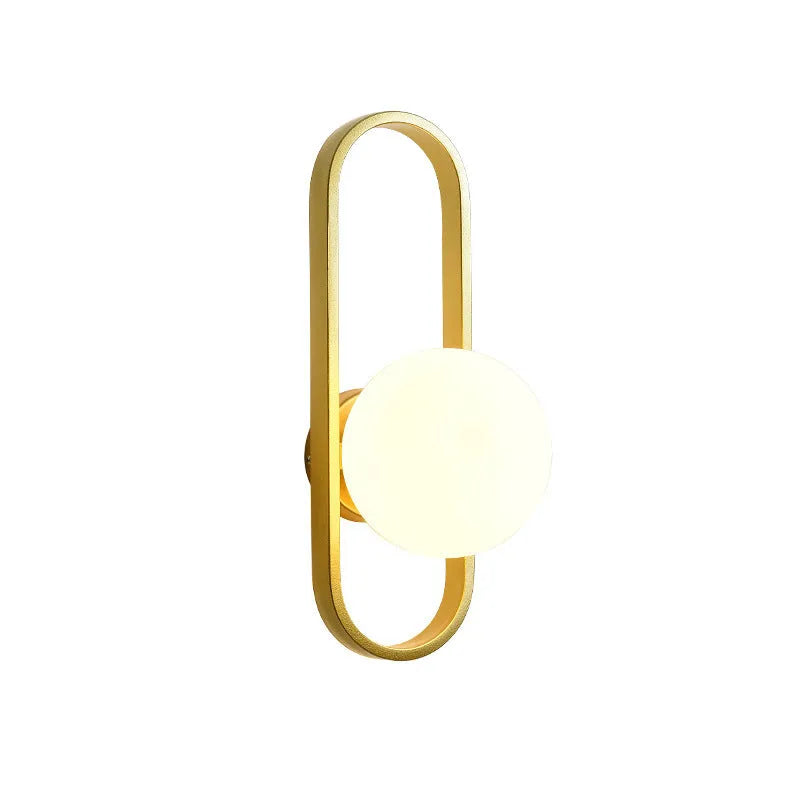 Modern minimalist wall lamp with clear glass shade and black iron mount, showing three light colour settings.