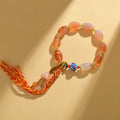 Handcrafted agate Tibetan bracelet with flower and geometric designs in vintage ethnic style