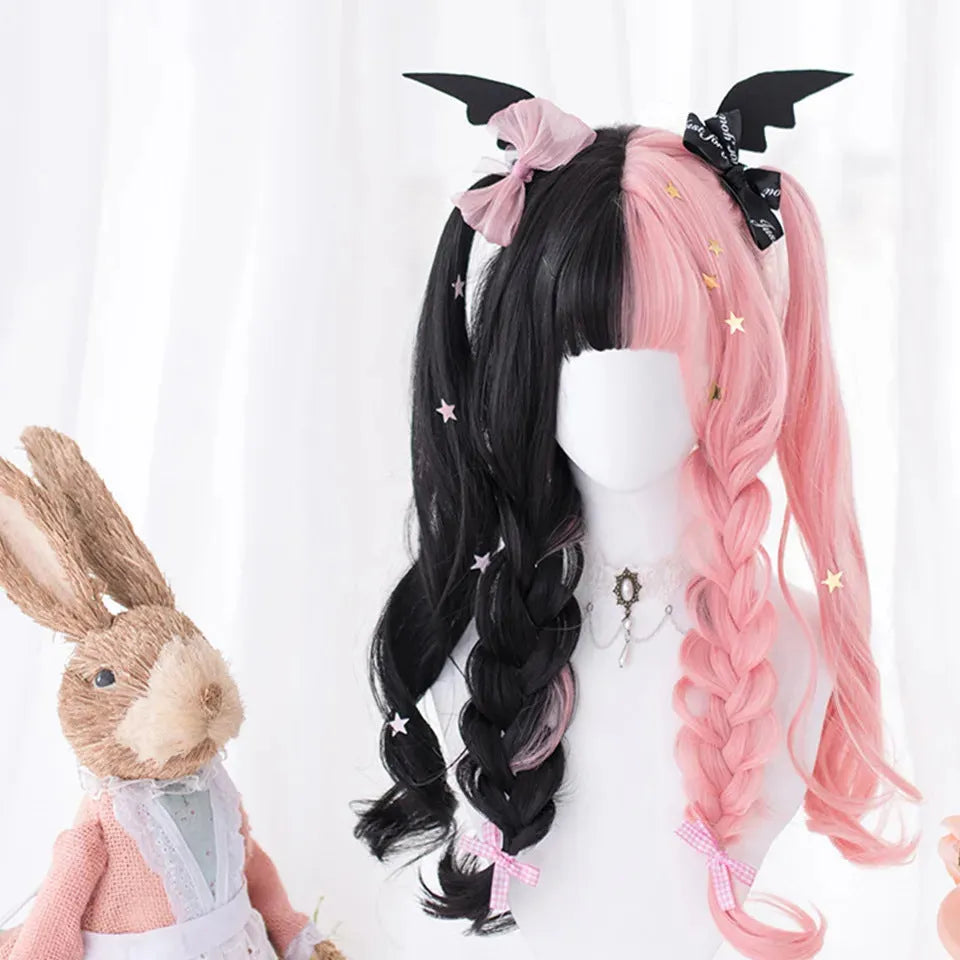 Harajuku Lolita long curly black and pink synthetic cosplay wig with bangs on a stand.