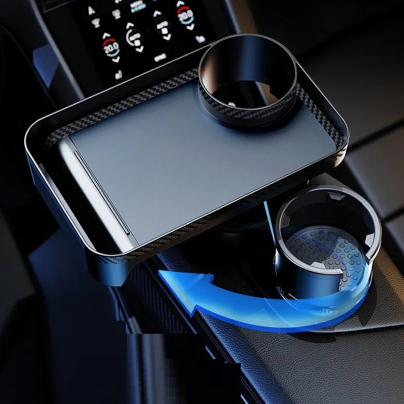 Black car cup holder with an integrated rotating dinner tray, shown in a vehicle.