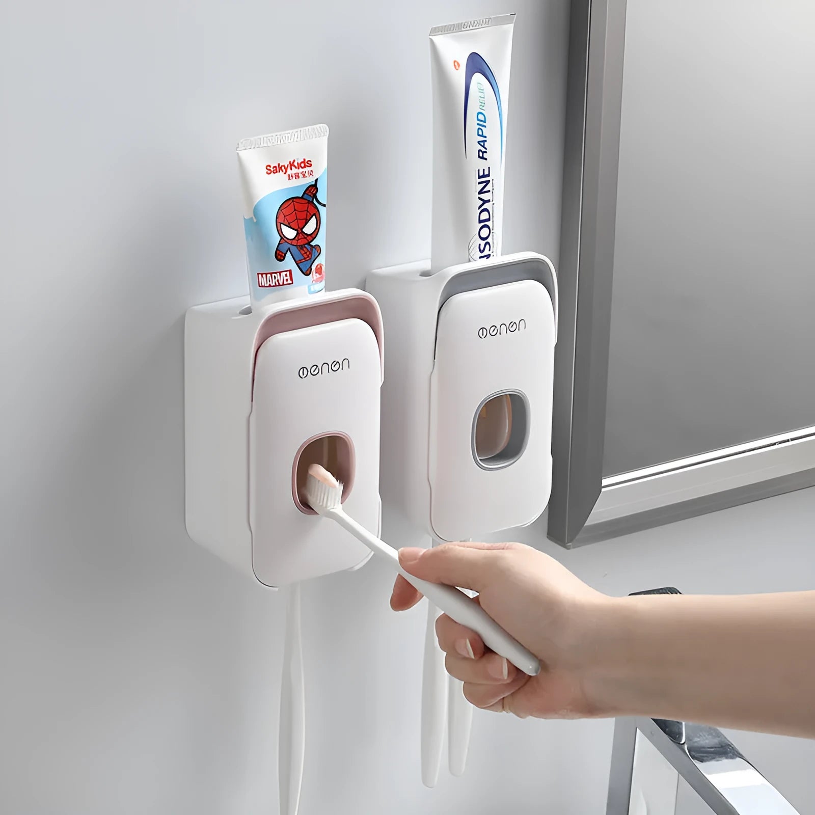Blue automatic toothpaste dispenser mounted on a bathroom wall with motion sensor.