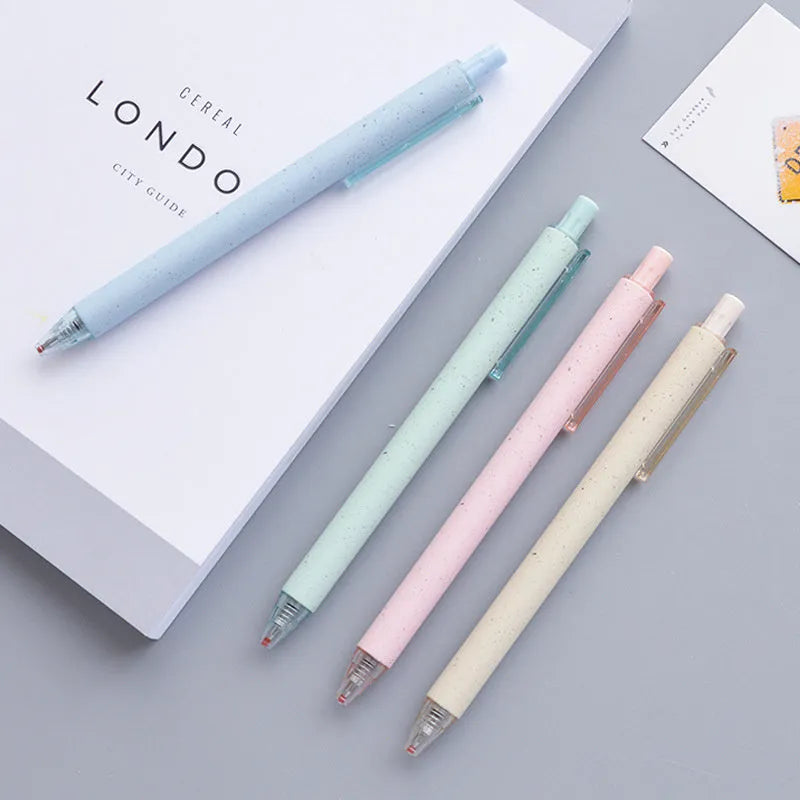 Set of twelve 0.5mm push-type gel pens in beige, blue, green, and pink barrels with black ink.