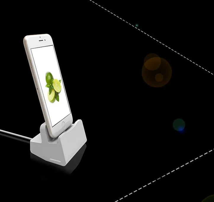 White headphone charging base with minimalist design on desk surface