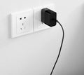Black ZMI USB-C 65W notebook power adapter showing compact size