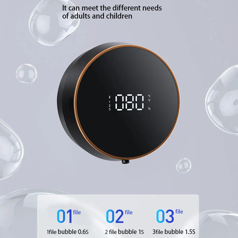 Black smart automatic foam dispenser mounted on a wall with hands activating the sensor.