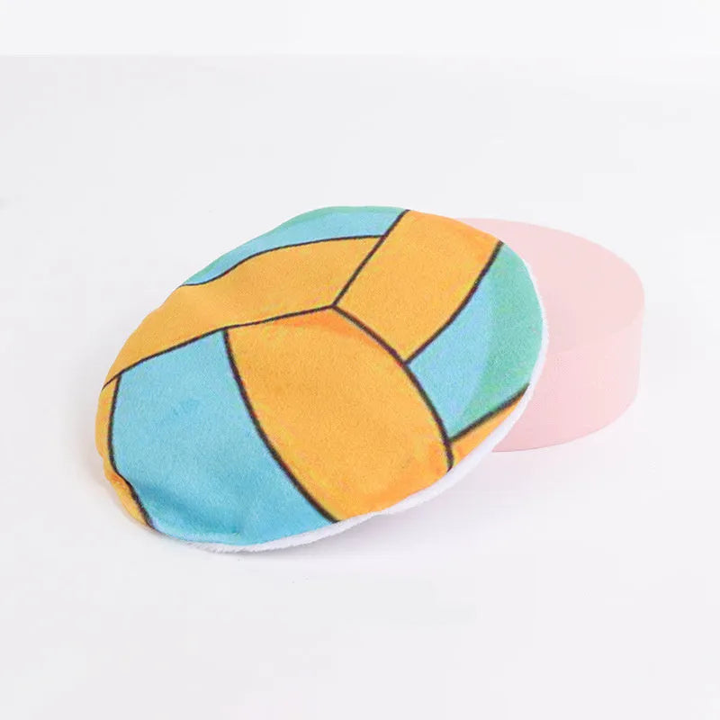Plush catnip flying disc toy with basketball pattern featuring crinkle sound interior